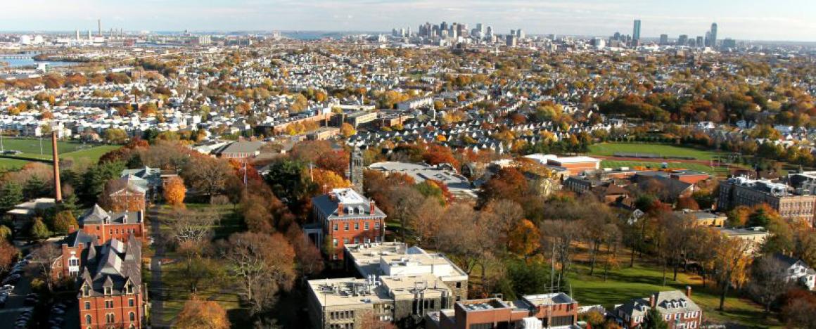 Aerial of tufts campus with Boston skyline in background
